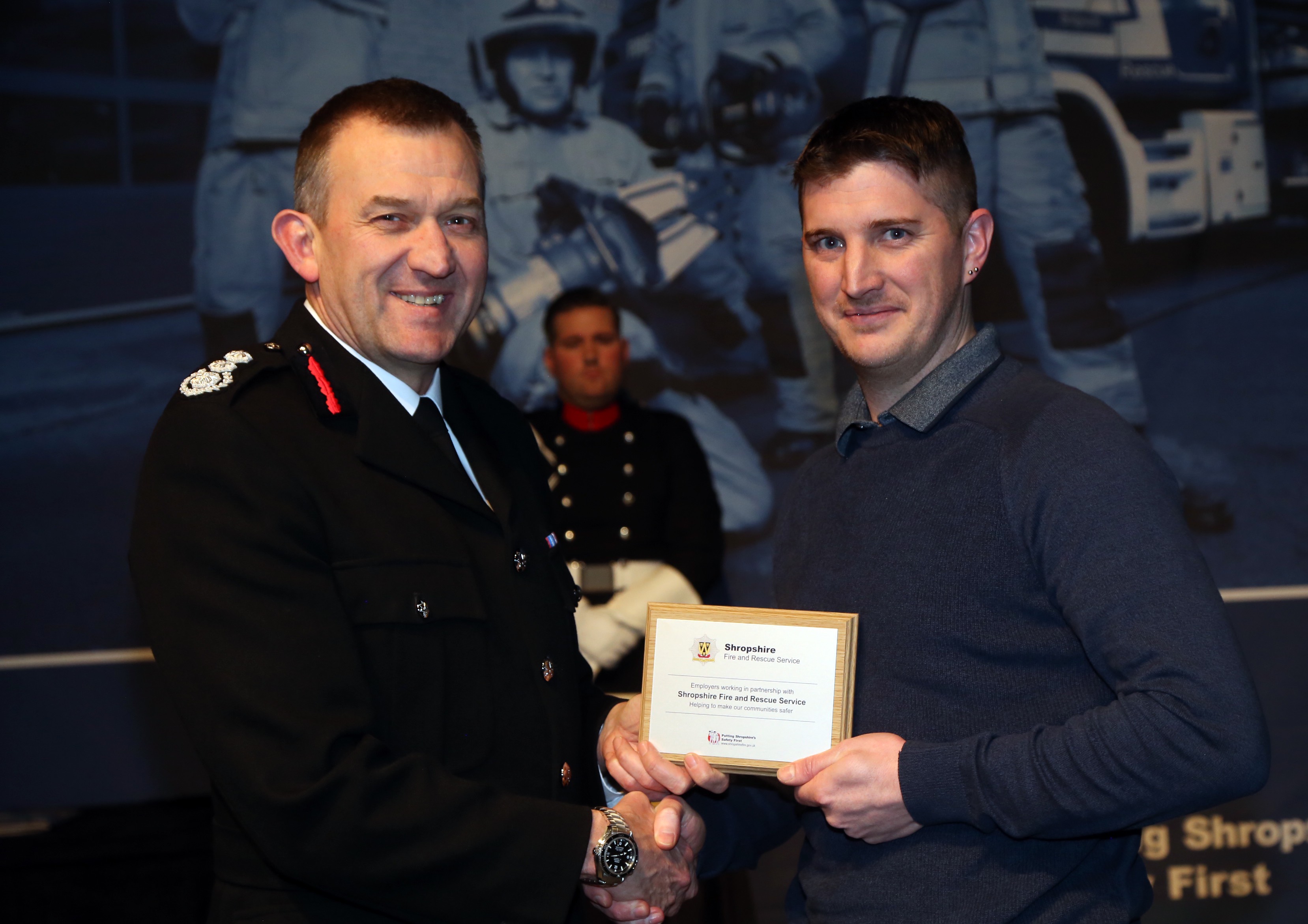 Furrows Customer Service Manager Richard Alderson receives the employers' award from Chief Fire Officer Rod Hammerton