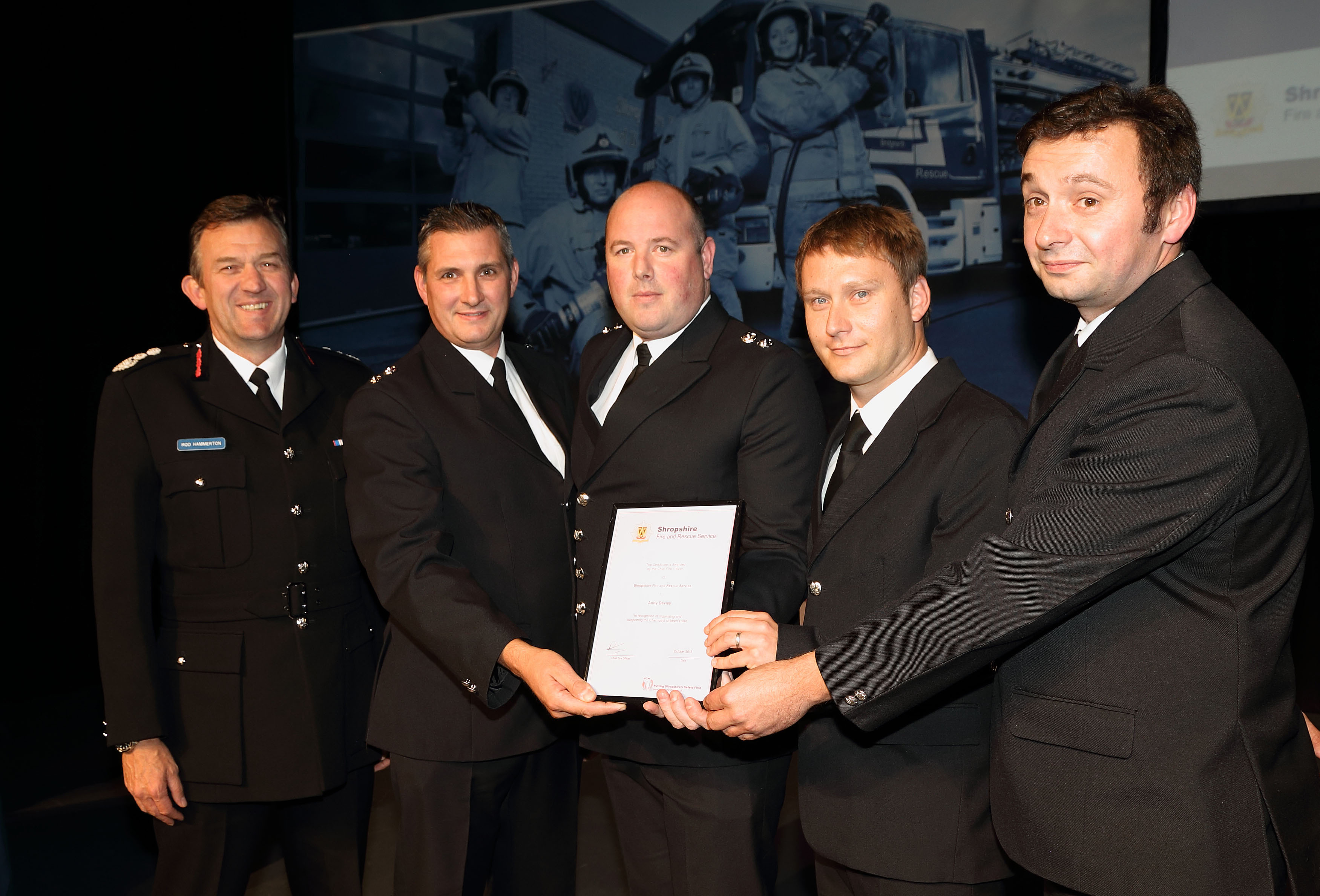 Blue Watch Shrewsbury received an award for their work with children from Chernobyl. Pictured with Chief Fire Officer Rod Hammerton are, left to right, Paul Gray, Richard Meadows, Andy Davies and Graham Carless.