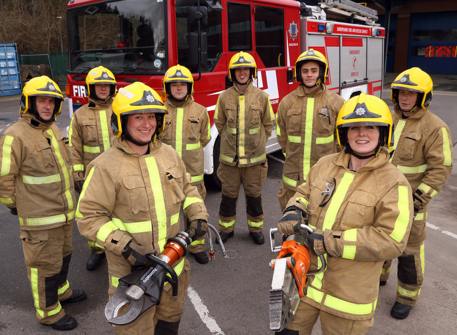 Kat Frost and Michelle Townsend with their fellow new recruits in training with Holmatro cutting gear to rescue car crash victims