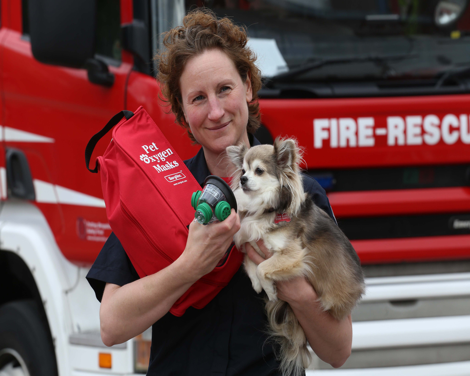 Firefighter Louise Fletcher with the pet oxygen mask