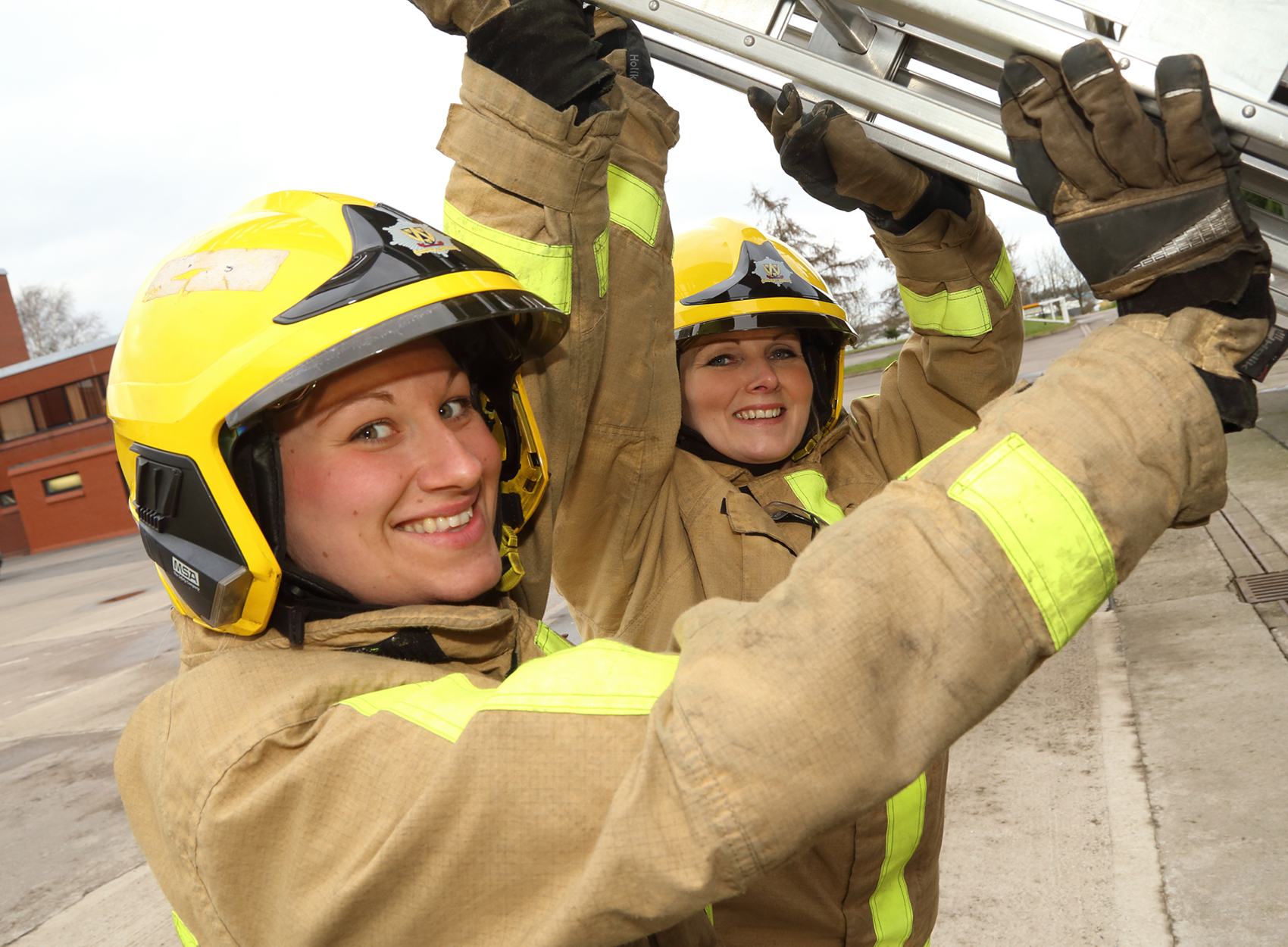 Kat Frost and Michelle Townsend in ladder training as they become the latest women firefighter recruits at Shropshire Fire and Rescue Service
