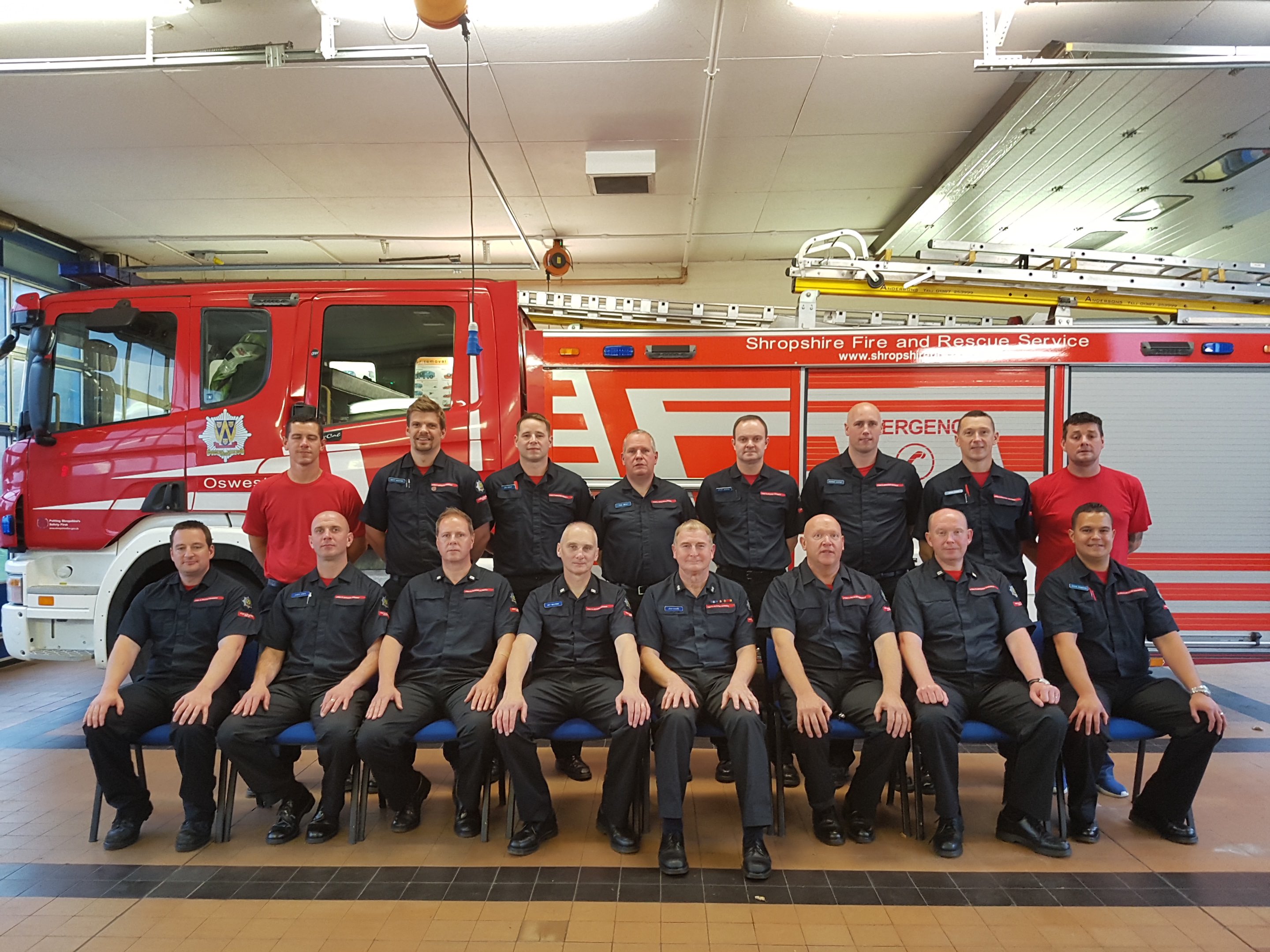Oswestry Watch Manager John Davies (fourth from right front row) retires after a 33 year career as an on call firefighter. PIctured with the Oswestry crew.