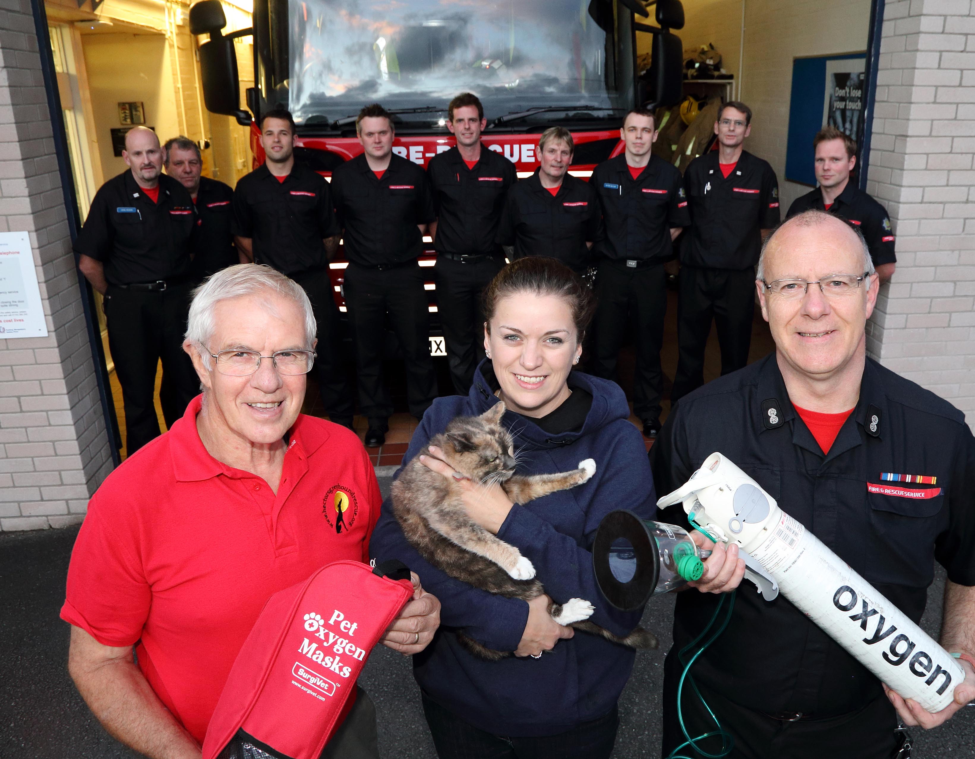 Ellesmere firefighters with fundraiser Fred Brown, pet owner Shelley Hall and Watch Manager Steve Moorhouse and Harriet the cat at Ellesmere Fire Station. Harriet is the first animal in Shropshire to be revived with the new pet oxygen mask after a house fire