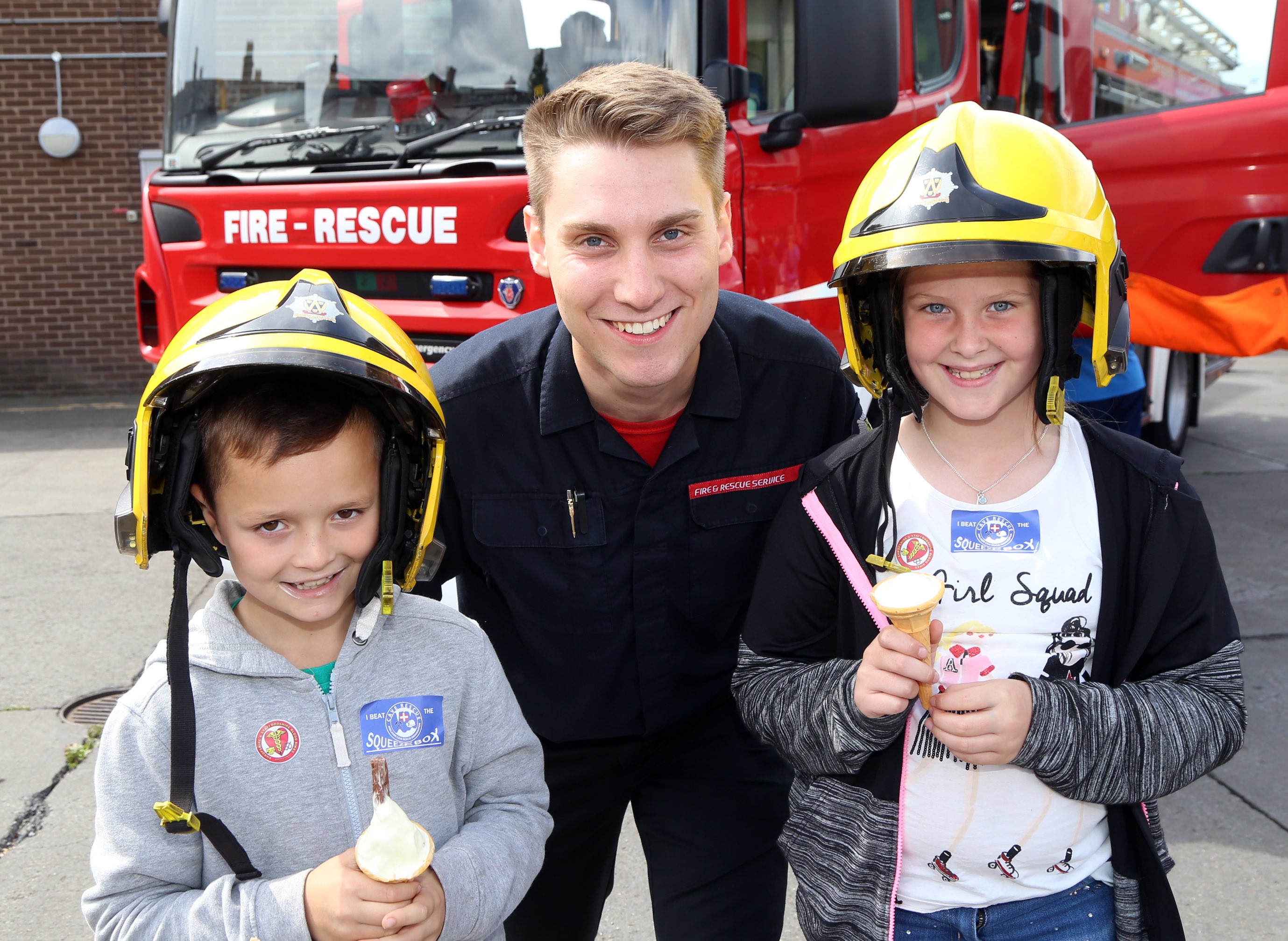 Wellington firefighter Louie Longhi with Freddie Treherne (9) and Lily Mae-Bailey (8), both from Shrewsbury.