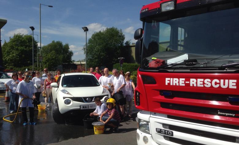 Shropshire firefighters join charity fundraisers in a Ludlow car wash