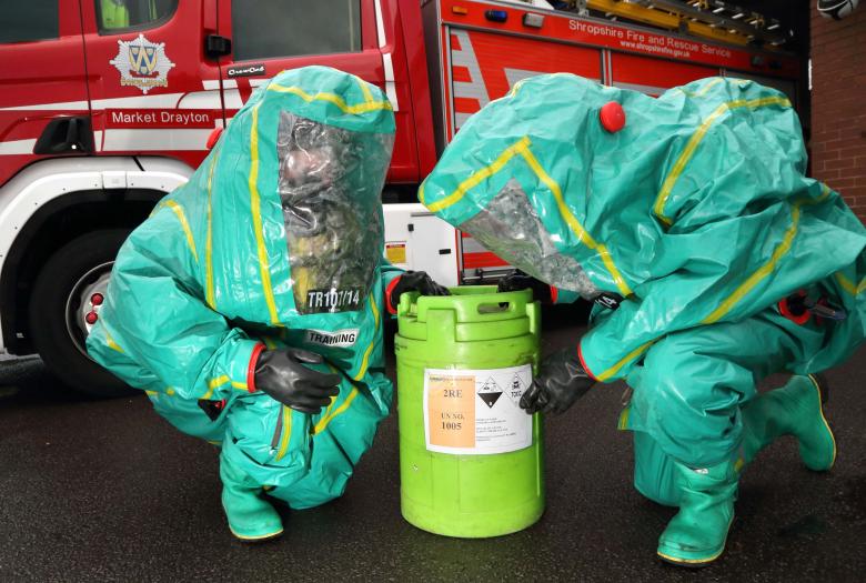 Market Drayton firefighters wear protective suits to train for a chemical leak at a weekly drill night