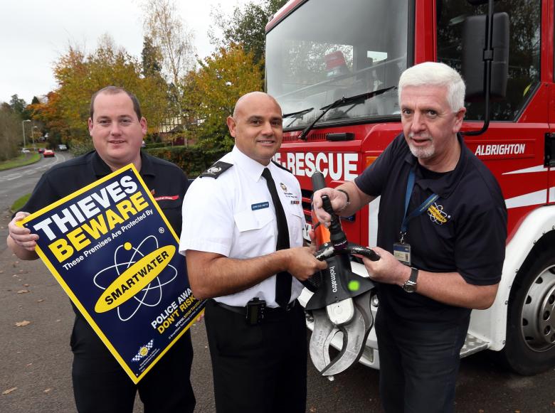 SmartWater’s Steve Mills, a former crime squad officer, shines an ultra violet light to identify stolen equipment and entrap thieves with Area Manager John Das Gupta and Andy Bevon (left), of Shropshire Fire and Rescue Service, at the scene of a “first ever” crime at Albrighton Fire Station.
