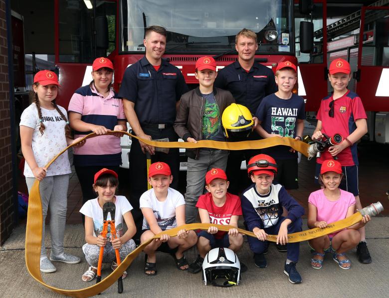 Chernobyl children had fun at Shrewsbury fire station. Pictured with firefighters James Fisher and Andy Davies (right).