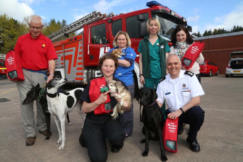 Shropshire pet lovers unite to raise funds for pet oxygen masks for firefighters. Left to right: Fred Brown (Hectors Greyhounds); firefighter Louise Fletcher, Haygate vet Tamsin Learoyd-Hill and vet head nurse Emma Carey with Amy Stewart (Happy Tails Dog Spa) and Watch Manager Martin Huckle (front right) 