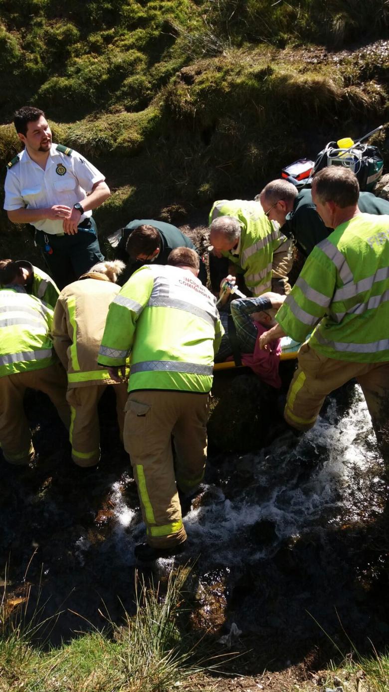 Firefighters and ambulance staff rescue walker Ian Dutton from the Long Mynd.