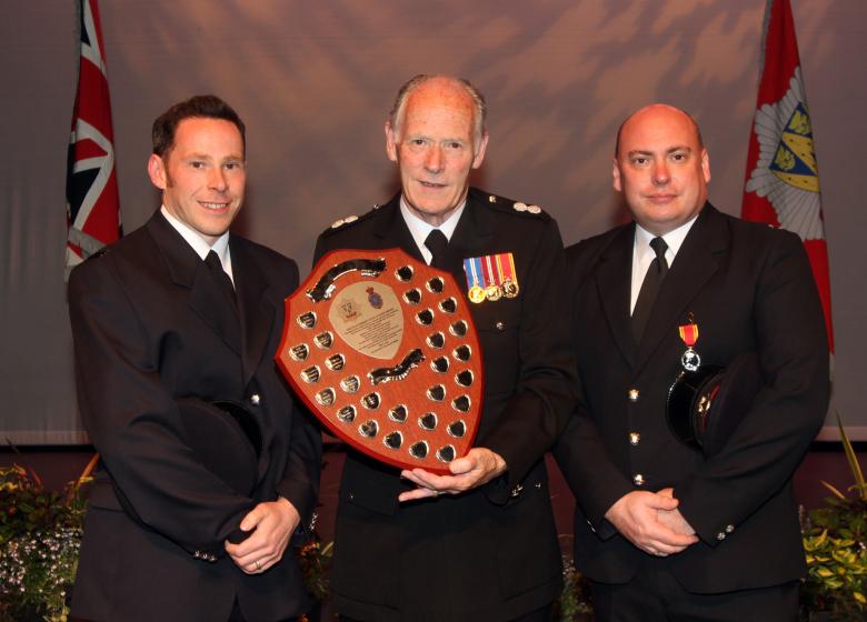 Roger Smith with sons either side receives High Sheriff shield