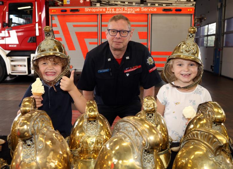 A definite thumbs up and widest possible grin from Riley Al Sadek (5) with sister Ruby Mai (7), from Shrewsbury, with Whitchurch firefighter Keith Robinson.