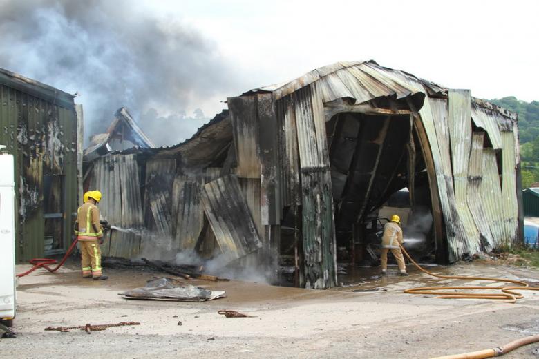 photo of badly damaged barn